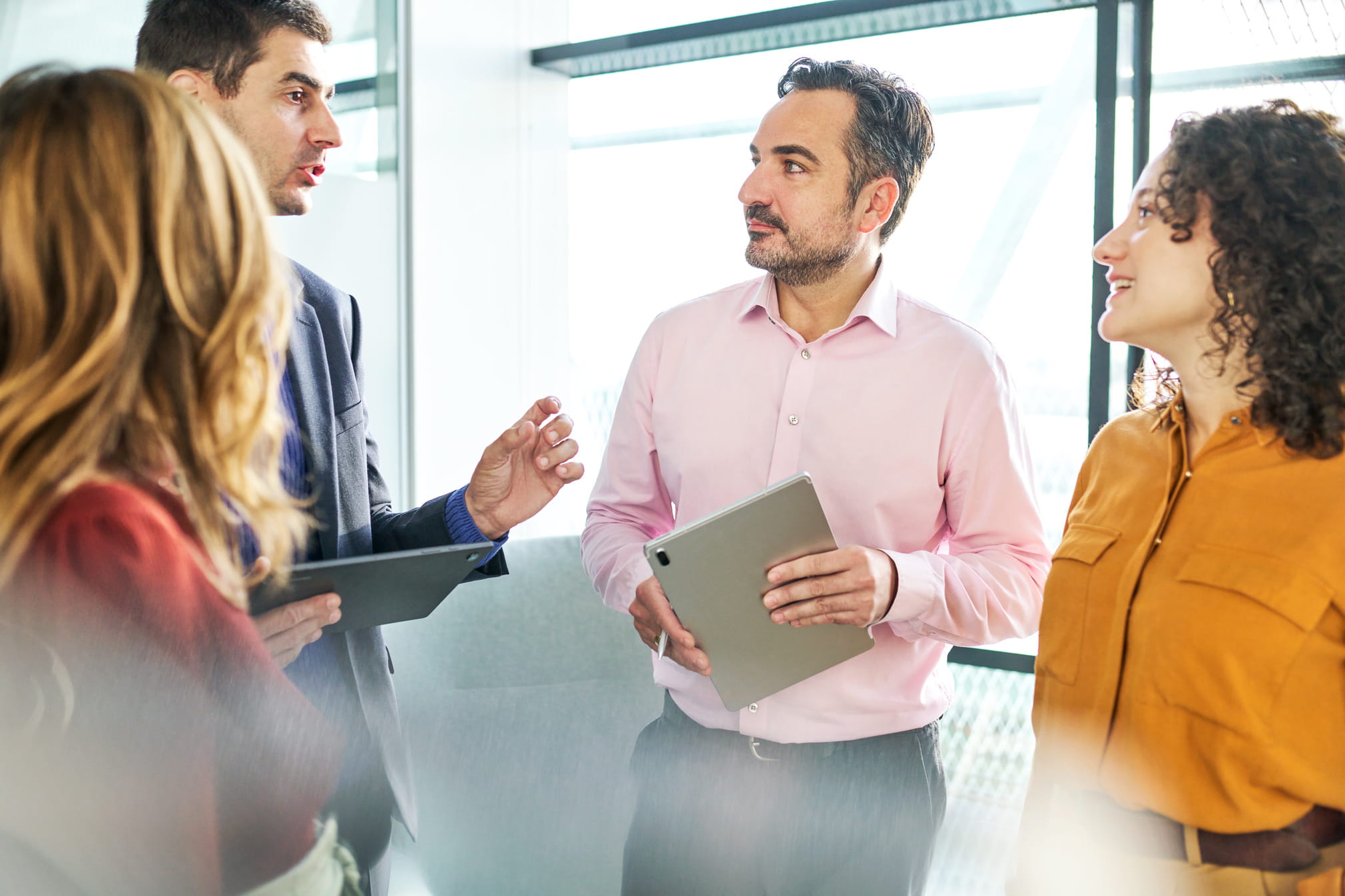 Two MIPS consulting services team members in a discussion with two specialty practice members