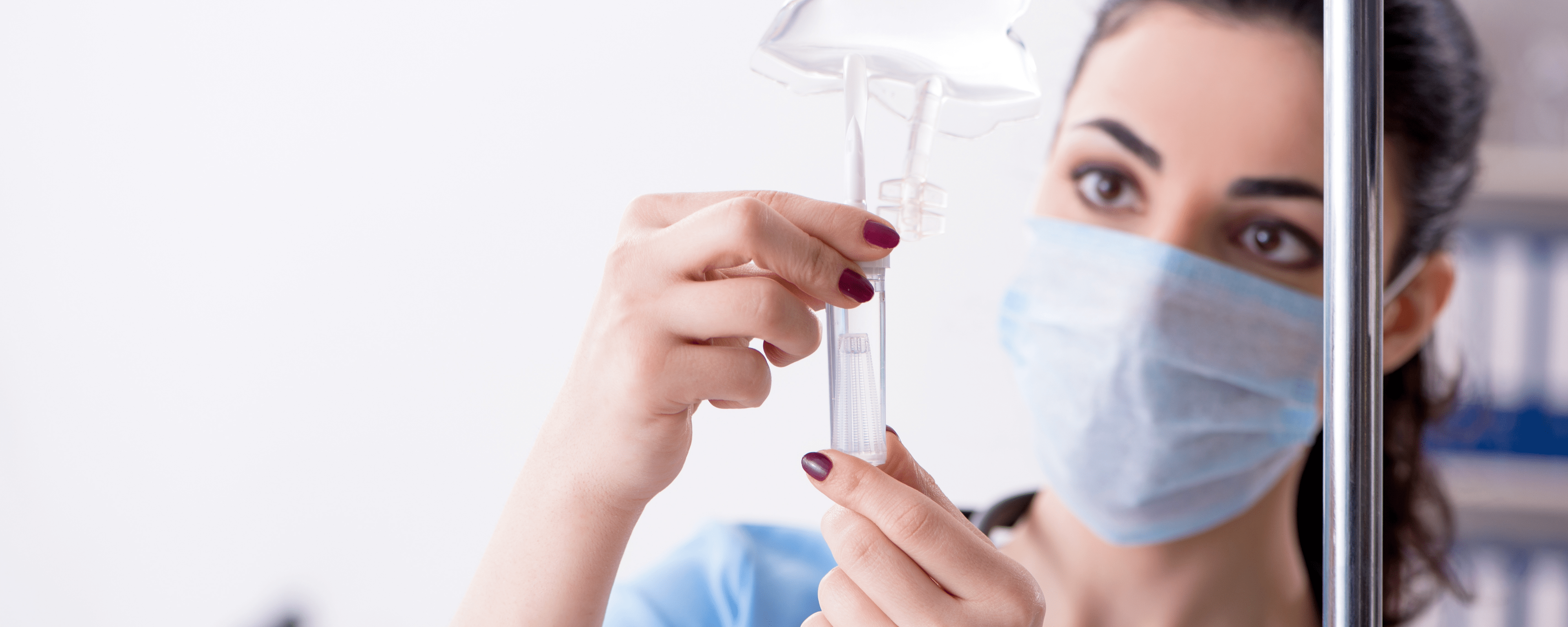 nurse administrating infusion through IV